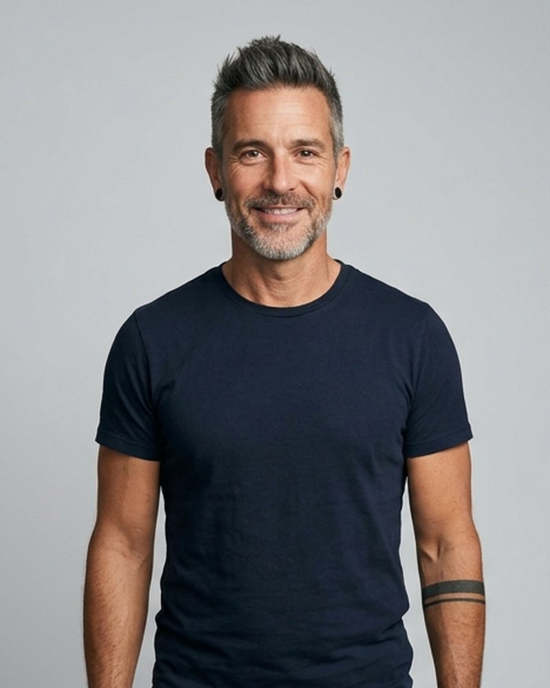 Max Reverb, a silver-haired 46-year-old in a navy t-shirt, smiling (AI-generated image)
